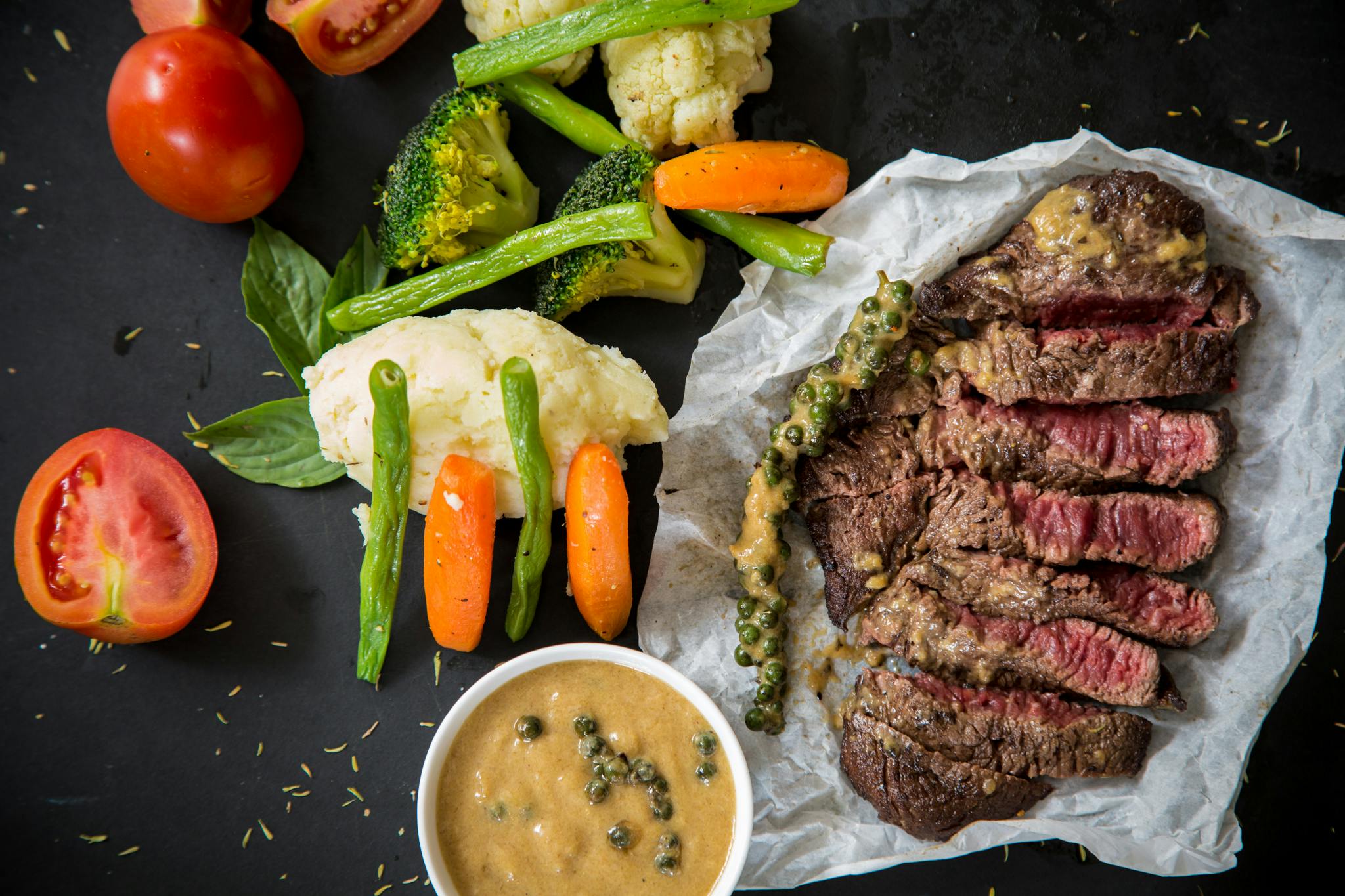 A healthy meal with steak and vegetables